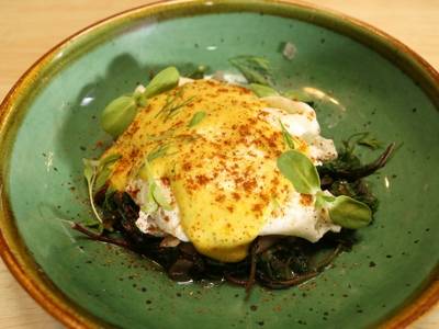 Poached Eggs with Ghee Hollandaise And Indian Greens